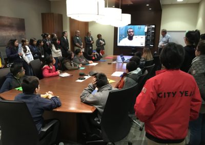 Students gather in Creative Business Interiors Boardroom